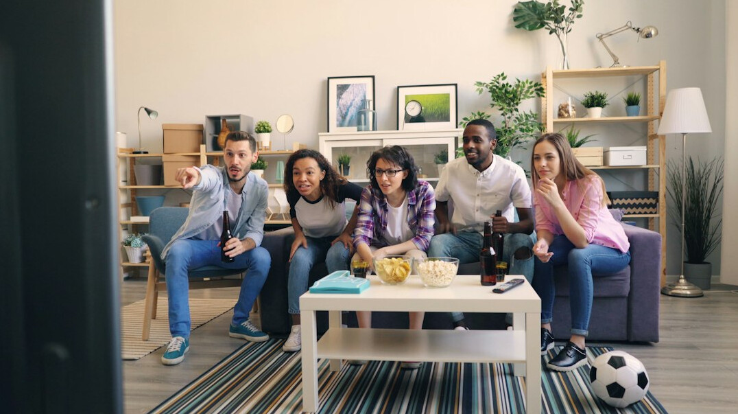 group of people watching tv